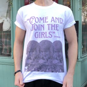 A white T-shirt with purple ink with the words 'Come And Join The Girls' at the top, plus 'Morrissey in smaller letters', and three identical images of Patricia Routledge across the bottom. She is holding flowers.